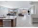 Open-concept living space showcasing a seamless flow between kitchen, dining, and living areas at 25974 W Horsham Dr, Buckeye, AZ 85396