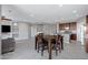 Open-concept space with a dining table, living room, and kitchen, perfect for entertaining and everyday living at 25974 W Horsham Dr, Buckeye, AZ 85396