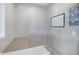 Functional home office with desk, calendar, metal storage rack and soft, natural light at 25974 W Horsham Dr, Buckeye, AZ 85396