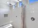 This bathroom has a tile shower with a built-in bench, multiple shower heads, and niche at 25974 W Horsham Dr, Buckeye, AZ 85396