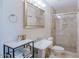 Bright bathroom with a large mirror, glass shower, and modern fixtures at 2611 E Cheryl Dr, Phoenix, AZ 85028