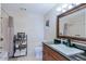 Bathroom featuring a shower and tub combination, classic decor, and sink at 2611 E Cheryl Dr, Phoenix, AZ 85028