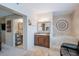 En suite bathroom featuring a soaking tub, separate sink, and designer accents at 2611 E Cheryl Dr, Phoenix, AZ 85028