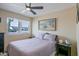 Bedroom showcasing a ceiling fan, a window with views, and neutral walls at 2611 E Cheryl Dr, Phoenix, AZ 85028