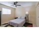 Cozy bedroom with a ceiling fan, natural light, and neutral-toned walls at 2611 E Cheryl Dr, Phoenix, AZ 85028