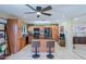 Bright kitchen featuring stainless appliances, granite counters, breakfast bar, and skylight with a ceiling fan at 2611 E Cheryl Dr, Phoenix, AZ 85028