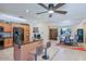 Updated kitchen with stainless steel appliances, island, and open layout to dining room at 2611 E Cheryl Dr, Phoenix, AZ 85028