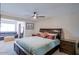 Calming primary bedroom boasting natural light, ceiling fan, and access to a sitting area at 2611 E Cheryl Dr, Phoenix, AZ 85028