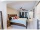 Spacious main bedroom featuring a ceiling fan, ensuite bathroom, and walk-in closet at 2611 E Cheryl Dr, Phoenix, AZ 85028