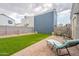 Inviting backyard with lush artificial turf, a paved patio, and comfortable lounge seating at 2731 E Windsor Ave, Phoenix, AZ 85008