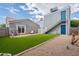 Expansive backyard featuring low maintenance artificial turf, a patio, and access to an upper level at 2731 E Windsor Ave, Phoenix, AZ 85008