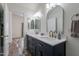 Bathroom features dual sinks, gold fixtures, and modern decor at 2731 E Windsor Ave, Phoenix, AZ 85008