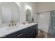 Bathroom features dual sinks, gold fixtures, and a shower/tub combo at 2731 E Windsor Ave, Phoenix, AZ 85008