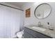 Stylish bathroom features a modern vanity with granite countertop and decorative mirror at 2731 E Windsor Ave, Phoenix, AZ 85008