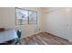 Charming bedroom showcasing a desk area and a closet, enhanced by the stylish wood-look flooring at 2731 E Windsor Ave, Phoenix, AZ 85008