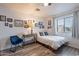 Inviting bedroom featuring a cozy bed, desk area, and charming wall decor for added personality at 2731 E Windsor Ave, Phoenix, AZ 85008