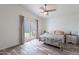 Bright bedroom features wood-look flooring and backyard access through sliding glass doors at 2731 E Windsor Ave, Phoenix, AZ 85008