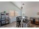 Charming dining area with vaulted ceilings, natural light, and modern light fixture at 2731 E Windsor Ave, Phoenix, AZ 85008