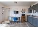Charming kitchenette with gray cabinets, desk area, and wall-mounted TV at 2731 E Windsor Ave, Phoenix, AZ 85008