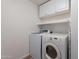 Functional laundry room featuring modern appliances and storage cabinets for added convenience at 2731 E Windsor Ave, Phoenix, AZ 85008
