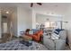Open-concept living room showcasing vaulted ceilings, wood-look floors, and seamless access to dining area at 2731 E Windsor Ave, Phoenix, AZ 85008