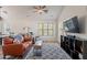 Comfortable living room with vaulted ceilings, wood-look floors, and stylish furnishings with natural light at 2731 E Windsor Ave, Phoenix, AZ 85008