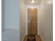 Entryway featuring a wood door, overhead light, and a decorative rug on wood floors at 29058 N Cactus Cir, San Tan Valley, AZ 85143