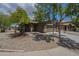 Single story home with a two car garage, desert landscaping, and a covered entry at 29058 N Cactus Cir, San Tan Valley, AZ 85143