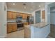 Bright kitchen featuring stainless steel appliances and wooden cabinets at 29058 N Cactus Cir, San Tan Valley, AZ 85143