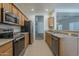 Kitchen featuring stainless steel appliances and wooden cabinets at 29058 N Cactus Cir, San Tan Valley, AZ 85143
