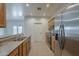 Kitchen featuring stainless steel appliances, and wooden cabinets at 29058 N Cactus Cir, San Tan Valley, AZ 85143