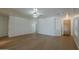 Open concept living room with wood floors, white walls, and access to the entryway at 29058 N Cactus Cir, San Tan Valley, AZ 85143