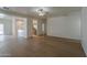 Open concept living room with wood floors, natural light, and access to kitchen at 29058 N Cactus Cir, San Tan Valley, AZ 85143
