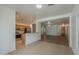 Open-concept living room flows into kitchen with stainless steel appliances at 29058 N Cactus Cir, San Tan Valley, AZ 85143