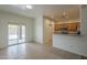 Eat-in kitchen area with a sliding glass doors, breakfast bar, and white walls at 29058 N Cactus Cir, San Tan Valley, AZ 85143