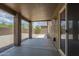 Enjoy outdoor relaxation on the covered patio overlooking the spacious gravel backyard and desert landscaping at 29058 N Cactus Cir, San Tan Valley, AZ 85143