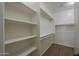 Walk-in closet with shelving and hanging racks for organization and storage at 29058 N Cactus Cir, San Tan Valley, AZ 85143