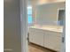 Well-lit bathroom featuring a double sink vanity with white cabinets and modern fixtures at 31866 N Bandit Rd, San Tan Valley, AZ 85143