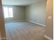 Cozy bedroom with plush carpeting, neutral walls, and a large window for natural light at 31866 N Bandit Rd, San Tan Valley, AZ 85143