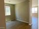 Spacious living room boasting ceramic tile floors and ample natural light from large windows at 31866 N Bandit Rd, San Tan Valley, AZ 85143