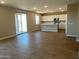 Open-concept living space features stylish tile flooring, recessed lighting, and a sliding glass door at 31866 N Bandit Rd, San Tan Valley, AZ 85143
