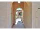 Arched entry leading to the home with a view of the front yard and landscaping at 36255 W Marin Ave, Maricopa, AZ 85138