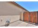 Exterior wall of home and closed wooden yard gate at 36255 W Marin Ave, Maricopa, AZ 85138