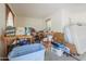 Cluttered garage with lots of storage and work space at 36255 W Marin Ave, Maricopa, AZ 85138