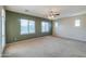 Spacious living room with plenty of natural light from large windows, creating a relaxing atmosphere at 36255 W Marin Ave, Maricopa, AZ 85138
