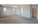Spacious main bedroom offering generous dimensions, neutral paint, and ensuite access at 36255 W Marin Ave, Maricopa, AZ 85138