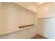 Walk-in closet featuring ample shelving and rods for organized storage at 36255 W Marin Ave, Maricopa, AZ 85138