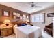 Comfortable bedroom featuring a ceiling fan, plush carpeting, and soft, warm lighting at 365 Leisure World --, Mesa, AZ 85206