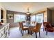 Open dining area with modern chandelier and large windows at 365 Leisure World --, Mesa, AZ 85206