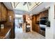 Open kitchen featuring oak cabinets, tile flooring and breakfast area beyond at 365 Leisure World --, Mesa, AZ 85206